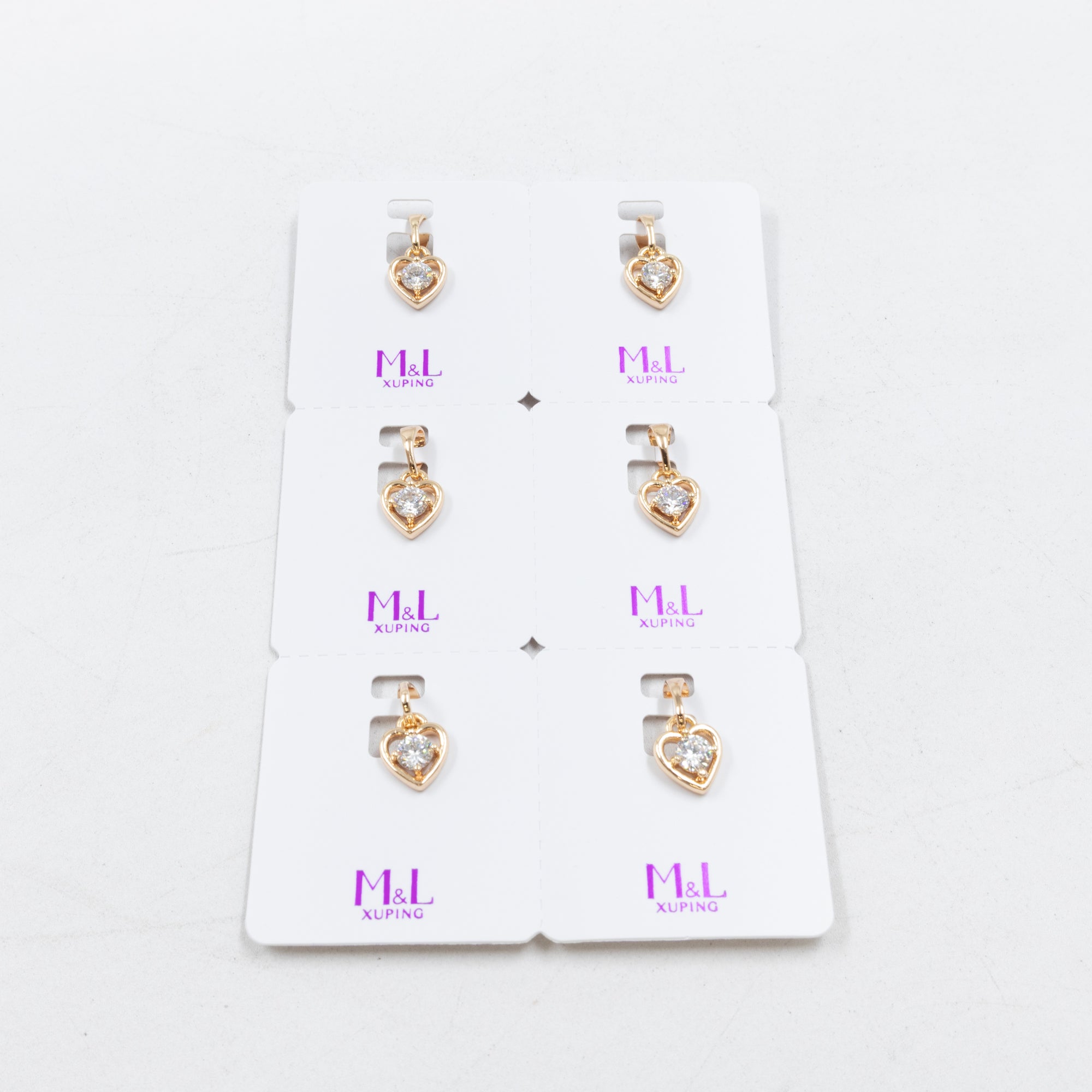 Paquete de 6 dijes con Piedras Oro Rosado  M7 Oro Laminado