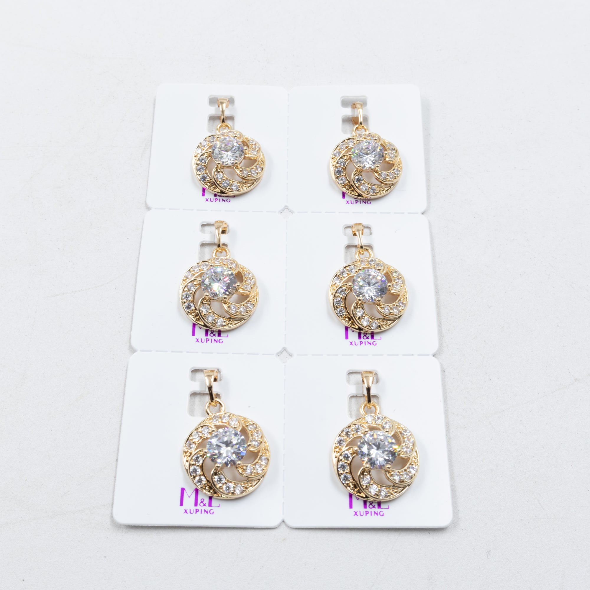 Paquete de 6 dijes con Piedras Oro Rosado  M1 Oro Laminado