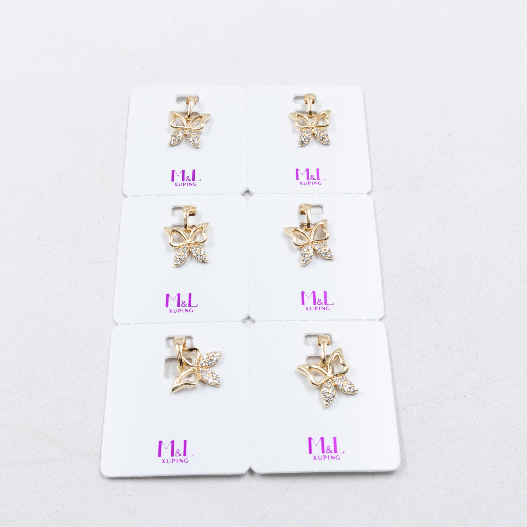 Paquete de 6 dijes con Piedras Oro Rosado  M4 Oro Laminado