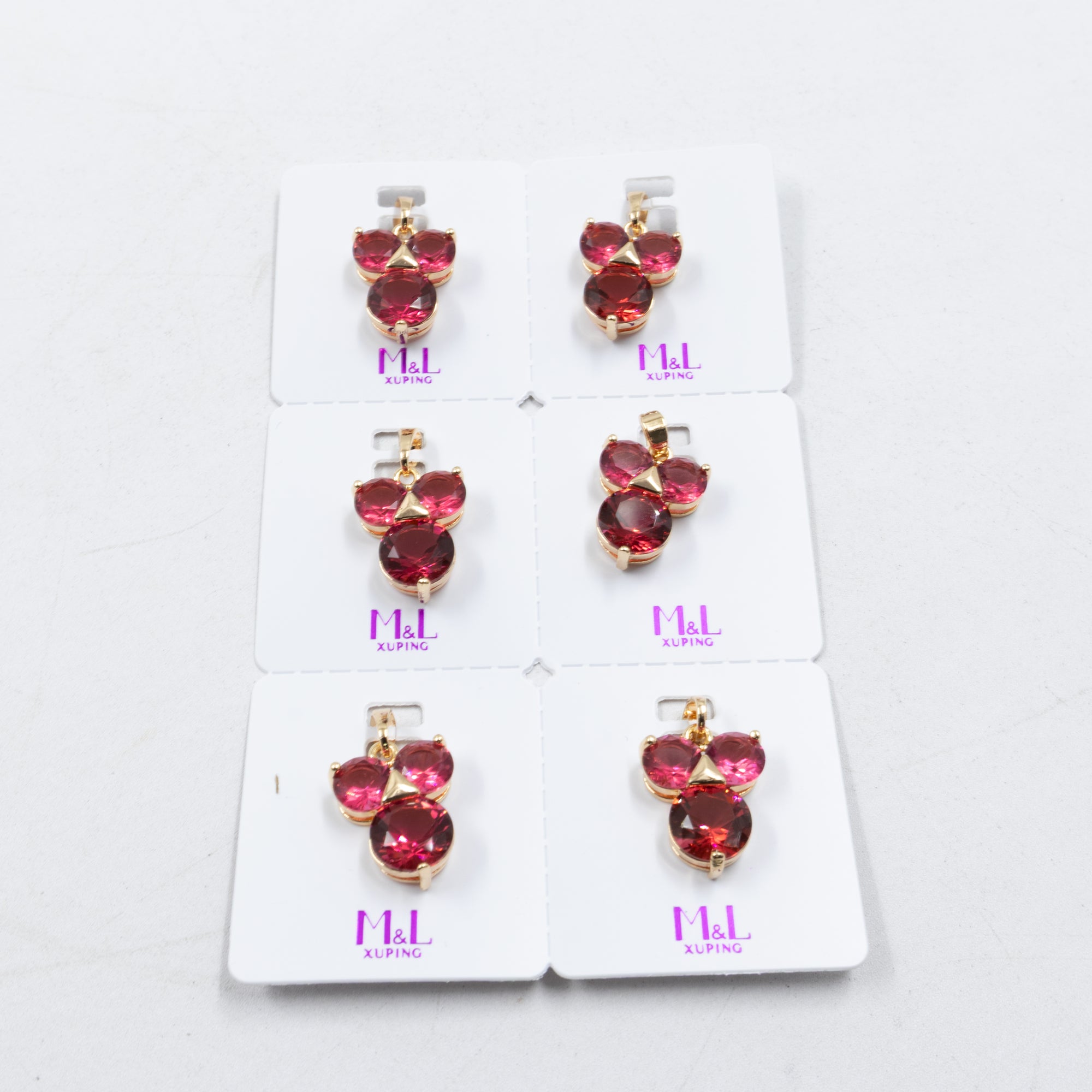 Paquete de 6 dijes con Piedras Oro Rosado  M1 Oro Laminado