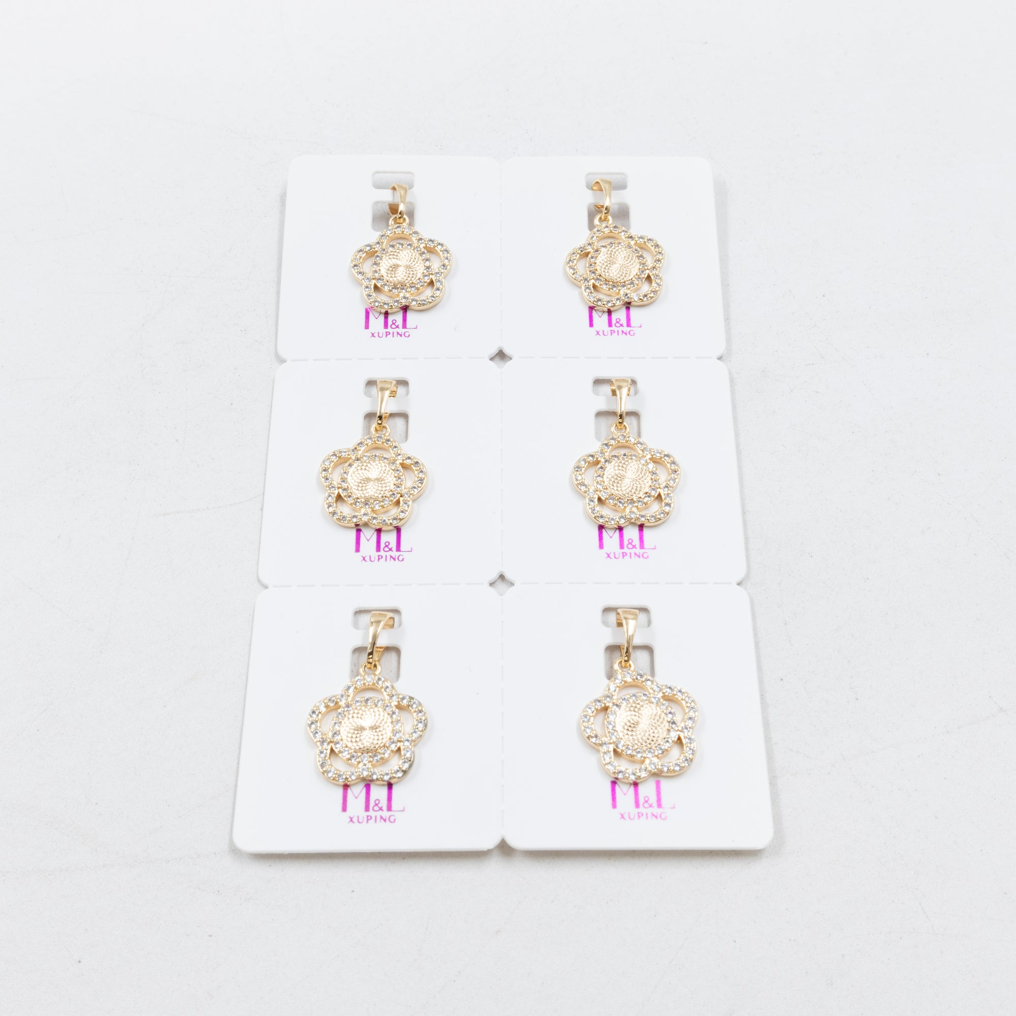 Paquete de 6 dijes con Piedras Oro Rosado  M7 Oro Laminado