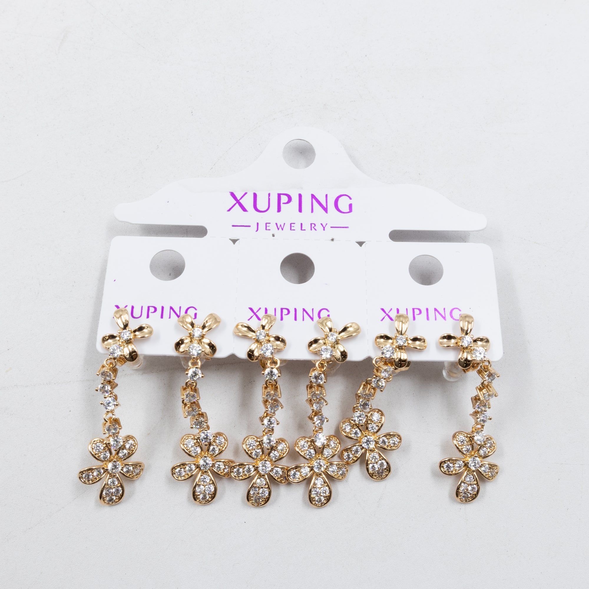 Paquete de tres pares de Aretes Dorados Xuping con piedras M7 Oro Laminado