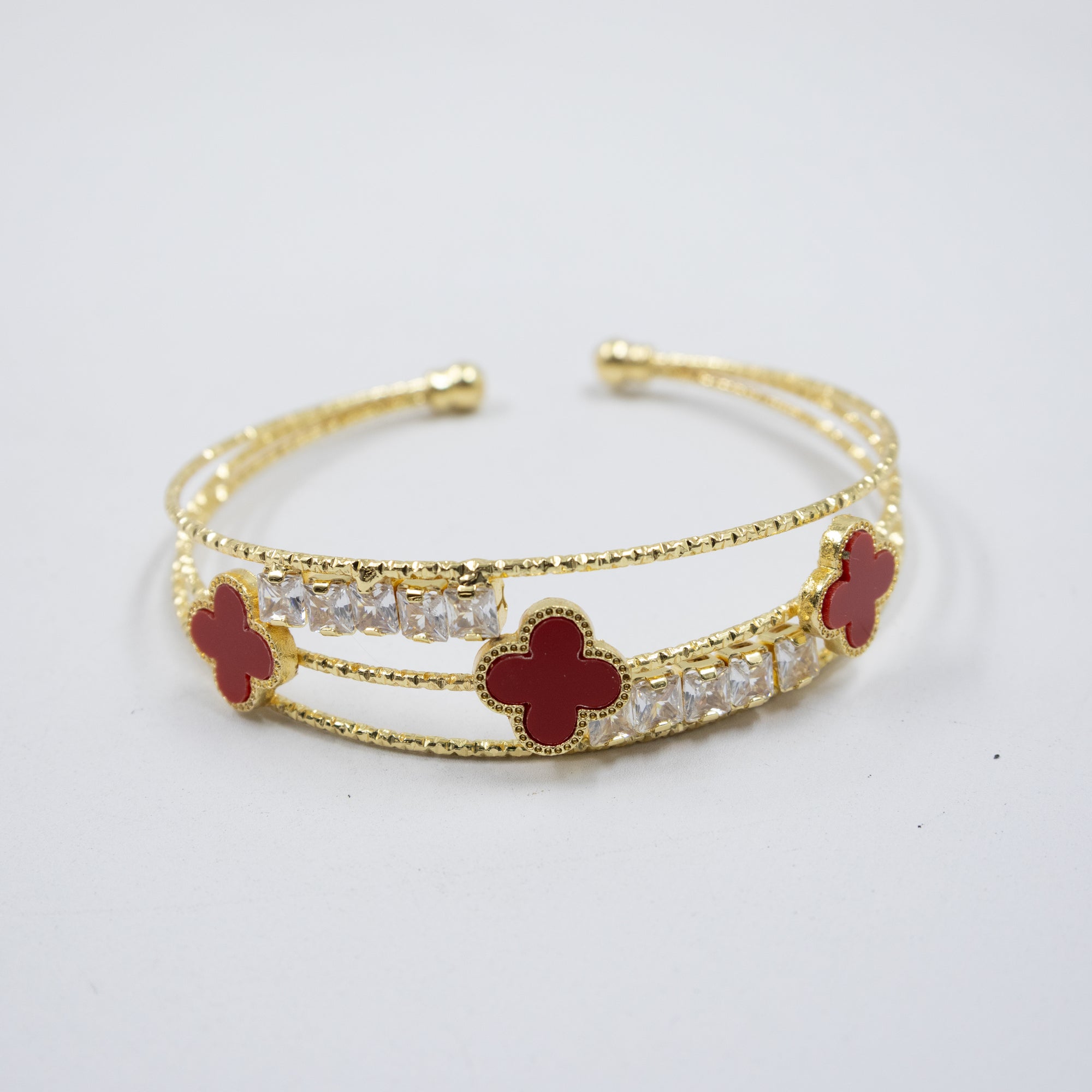 Pulsera dorada con flor y piedras blancas M1 Oro Laminado