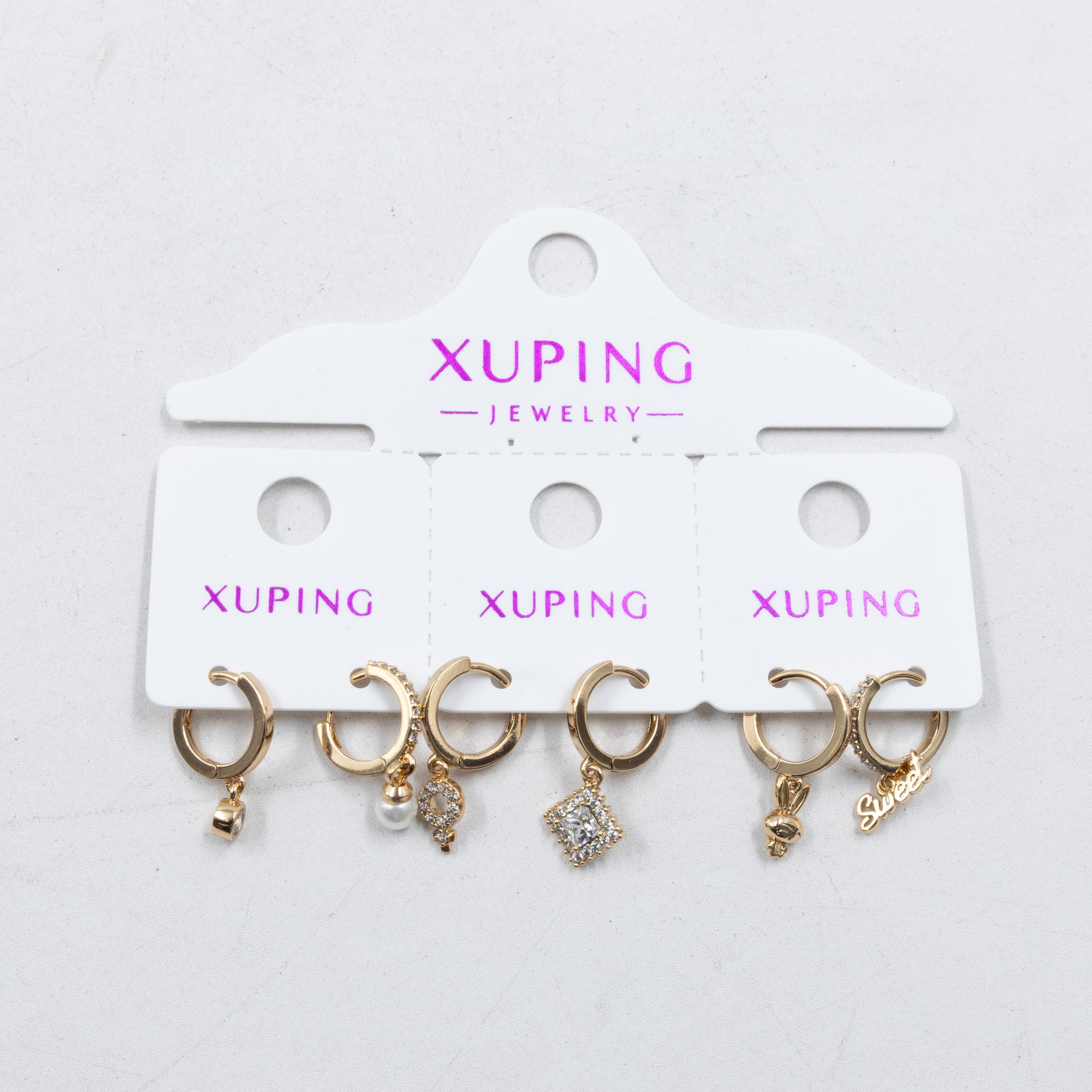 Paquete de tres pares de Aretes Dorados Xuping con piedras M5 Oro Laminado