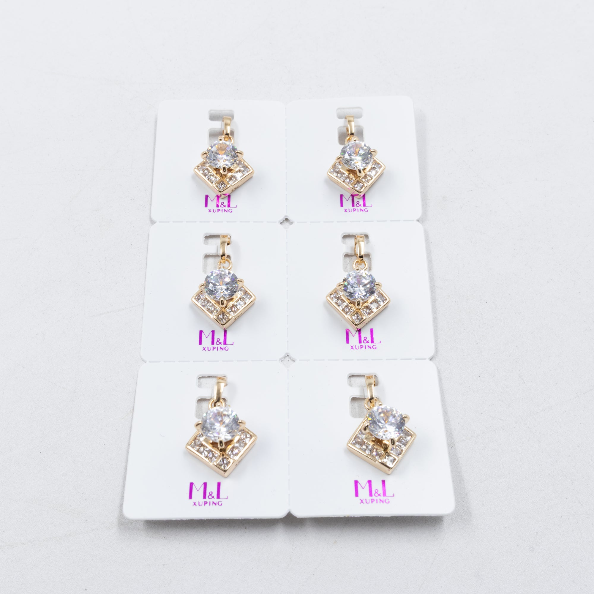 Paquete de 6 dijes con Piedras Oro Rosado  M2 Oro Laminado