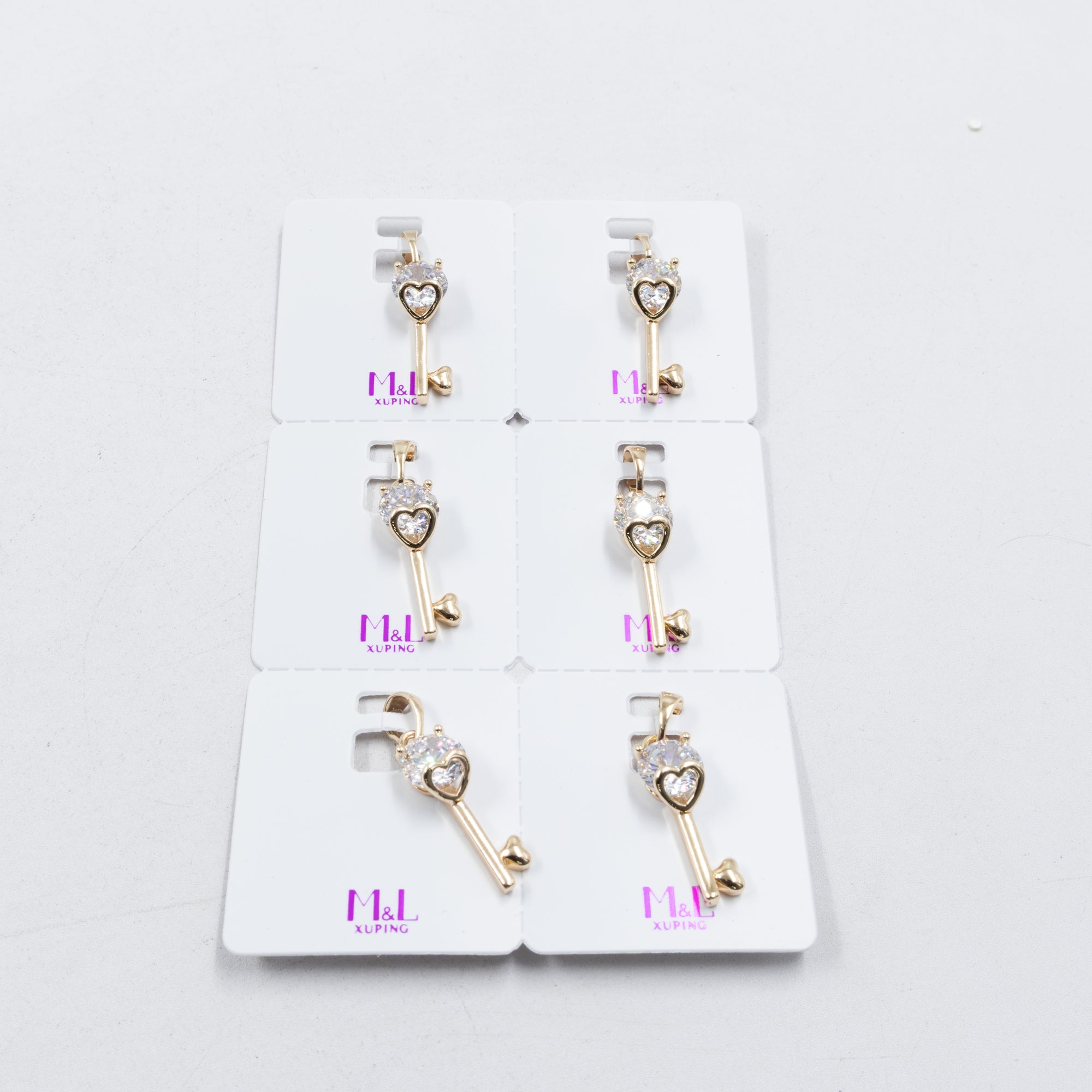 Paquete de 6 dijes con Piedras Oro Rosado  M3 Oro Laminado