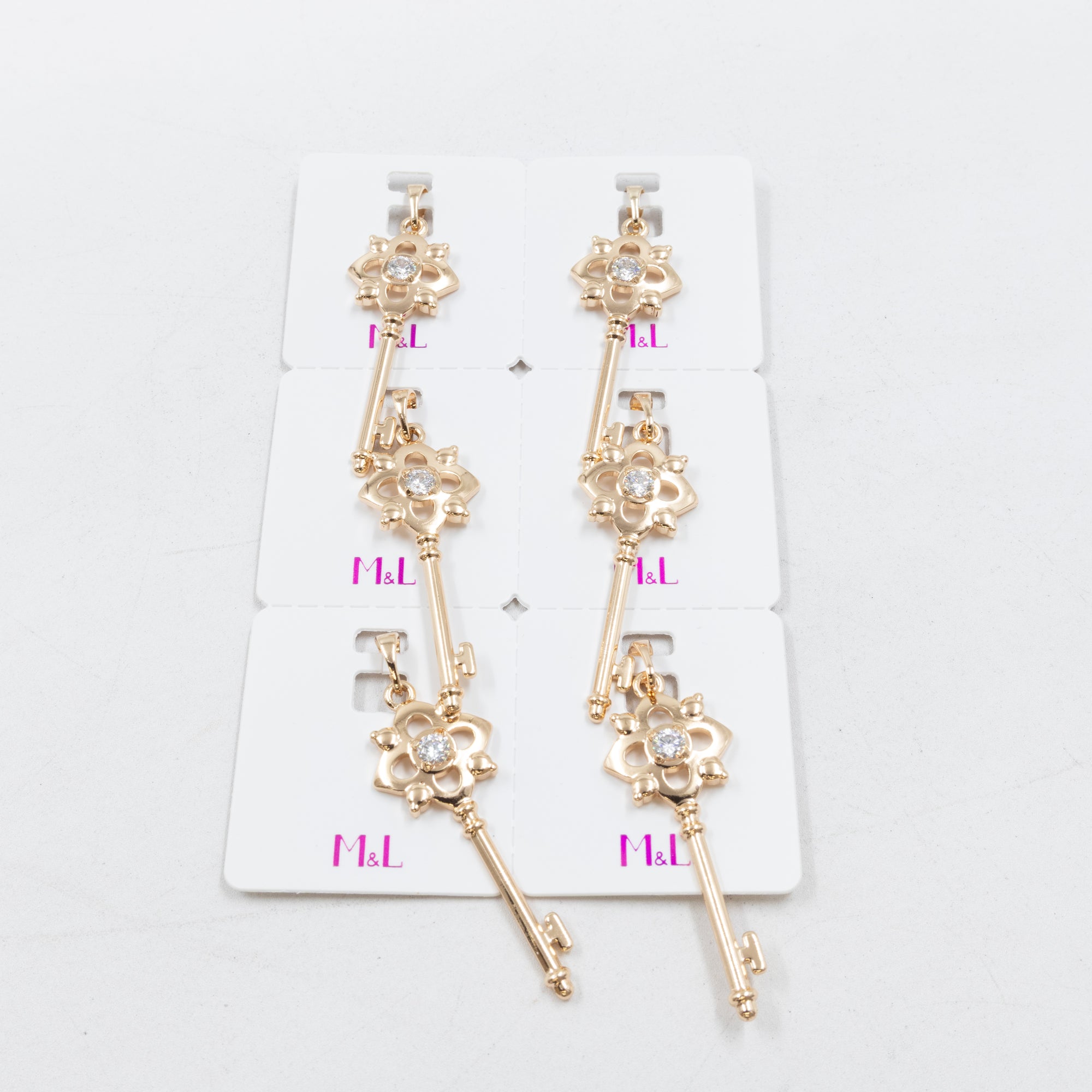 Paquete de 6 dijes con Piedras Oro Rosado  M7 Oro Laminado