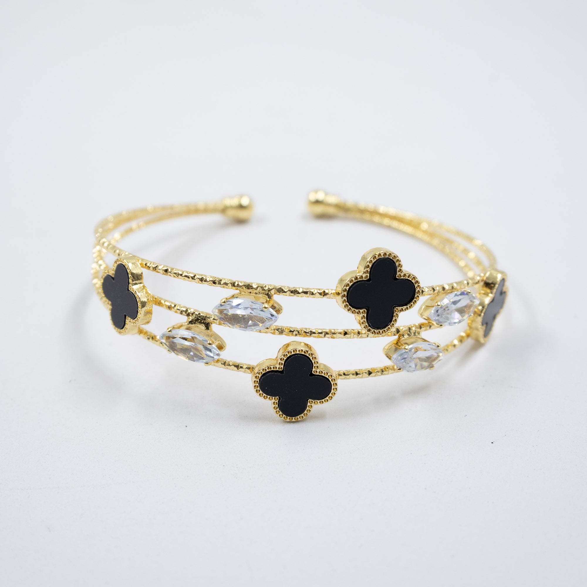 Pulsera dorada con flor y piedras blancas M1 Oro Laminado