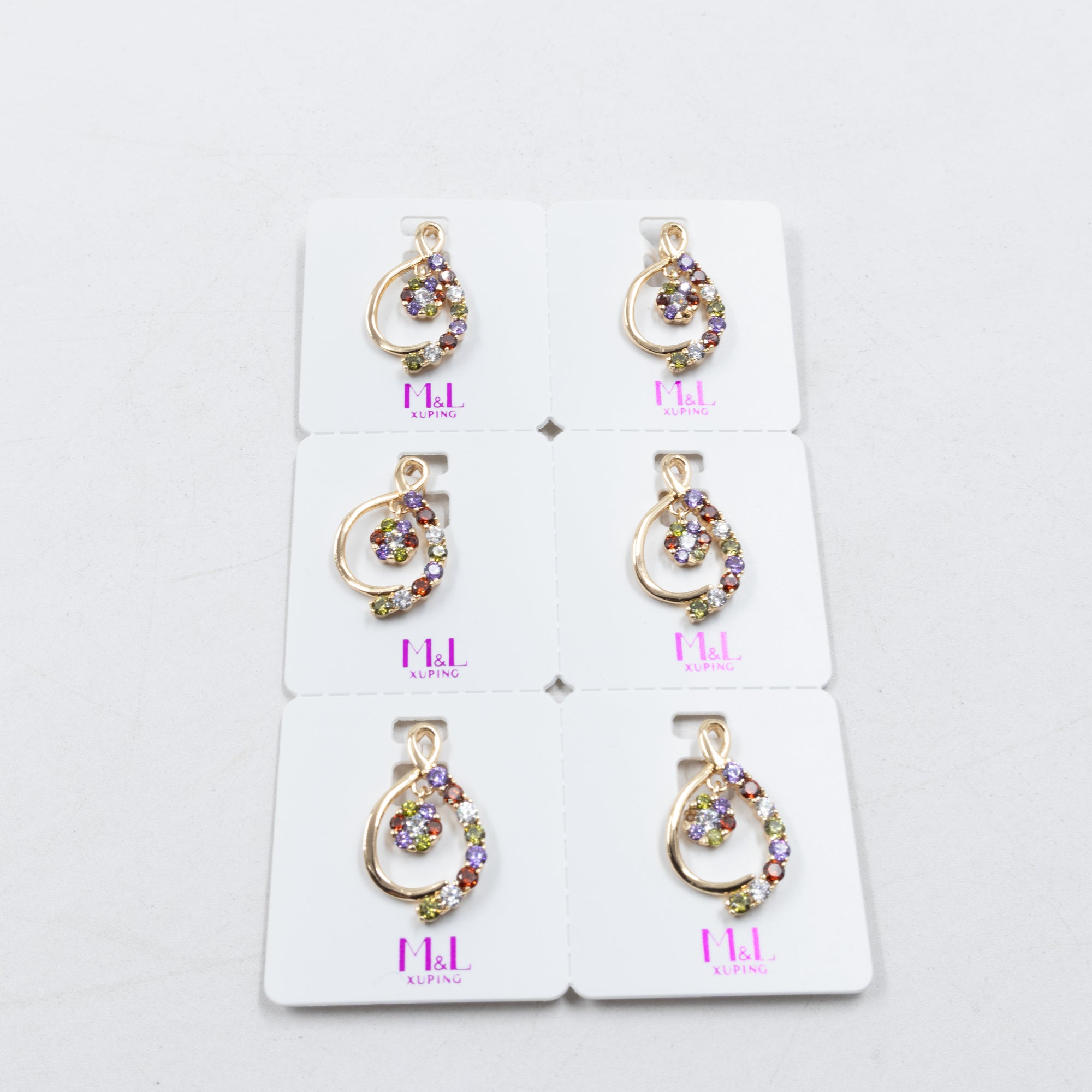 Paquete de 6 dijes con Piedras Oro Rosado  M2 Oro Laminado