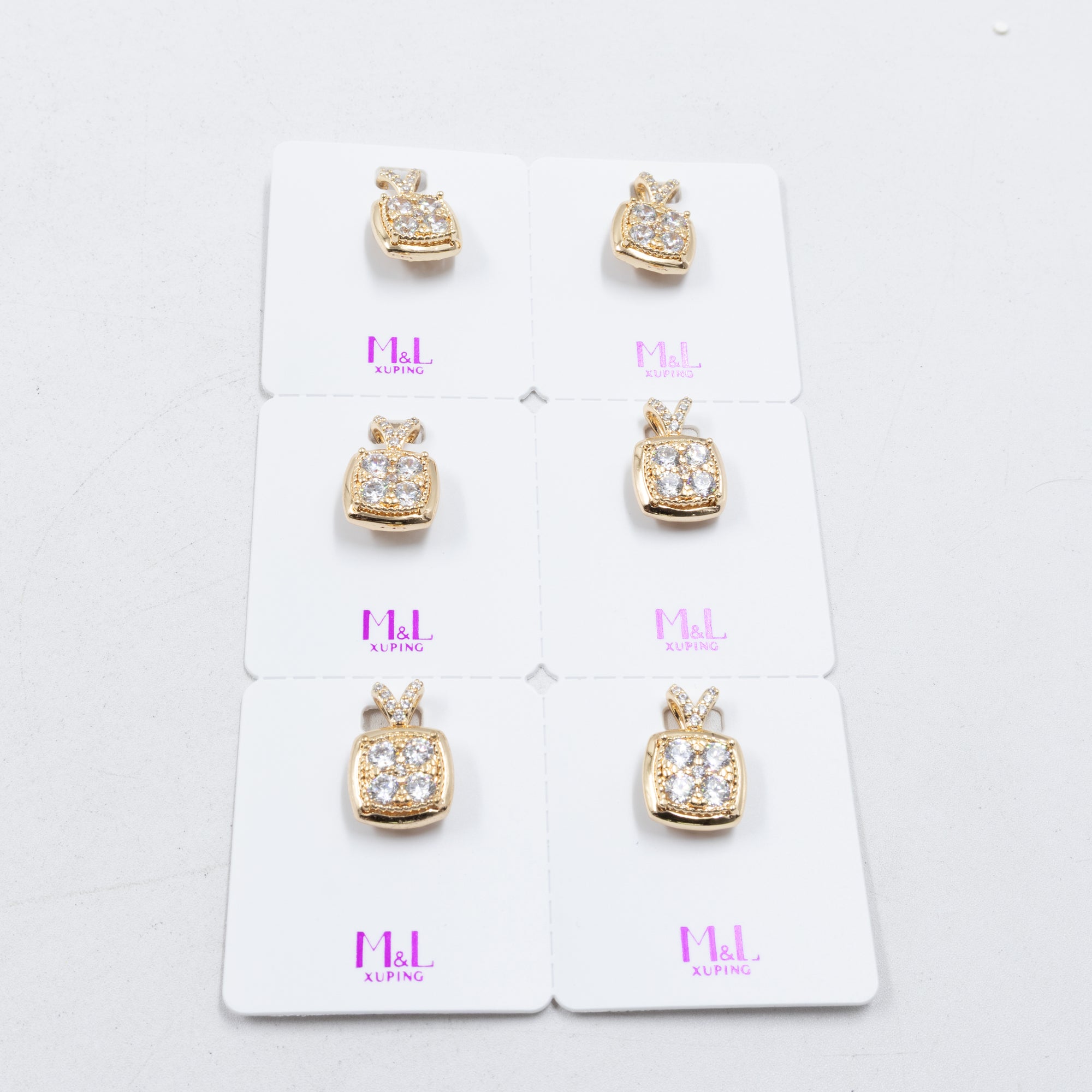 Paquete de 6 dijes con Piedras Oro Rosado  M3 Oro Laminado