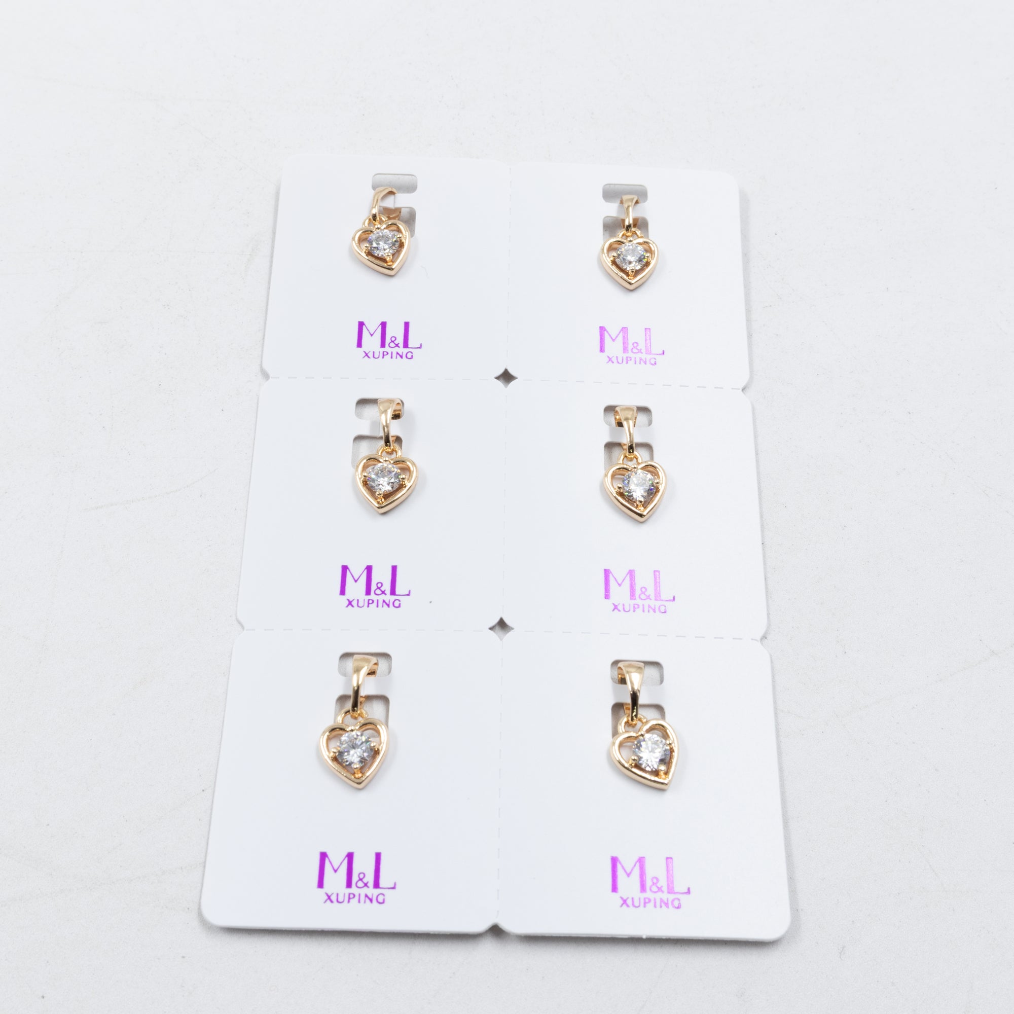 Paquete de 6 dijes con Piedras Oro Rosado  M1 Oro Laminado