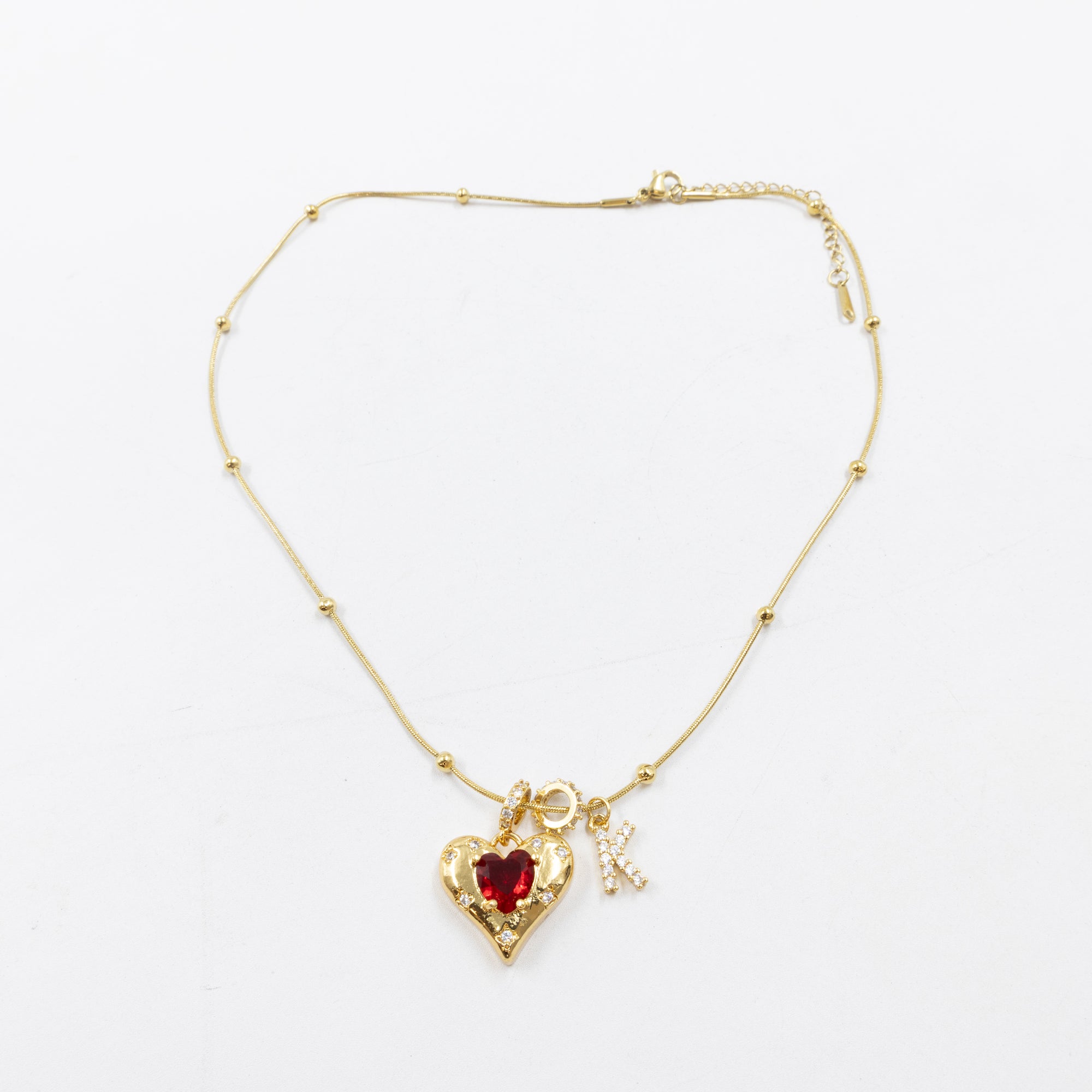 Collares Dorados con dije de Letra y corazón M2 Oro Laminado