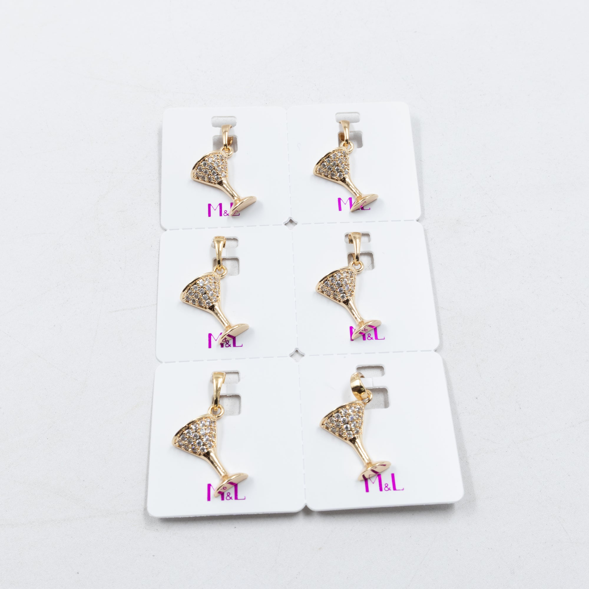 Paquete de 6 dijes con Piedras Oro Rosado  M4 Oro Laminado