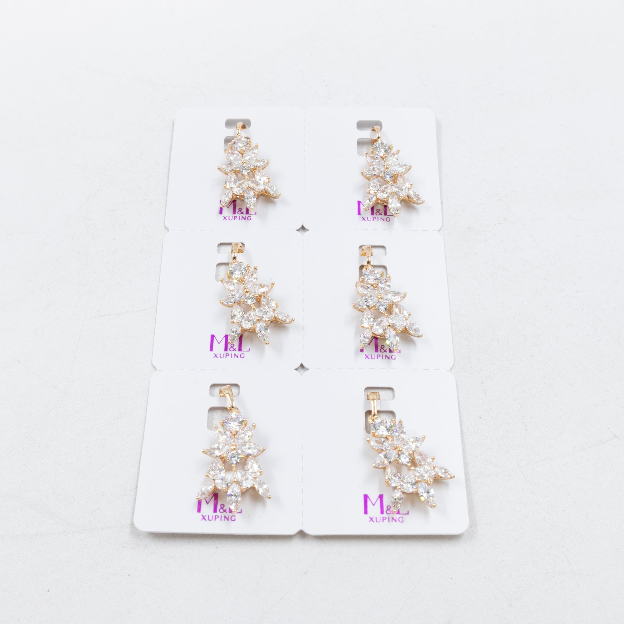 Paquete de 6 dijes con Piedras Oro Rosado  M7 Oro Laminado
