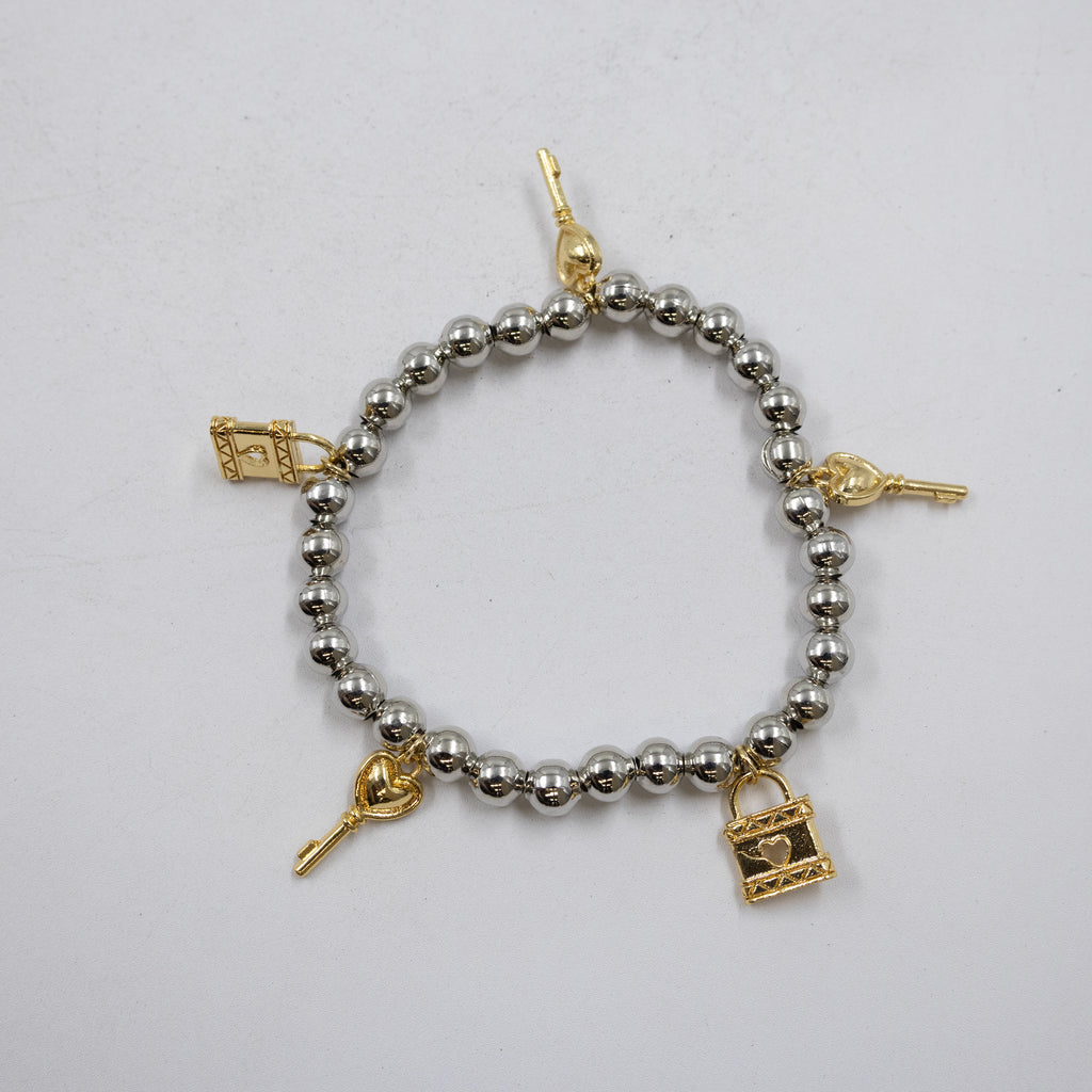 Pulseras Doradas y Plateadas con dije M1 Oro Laminado