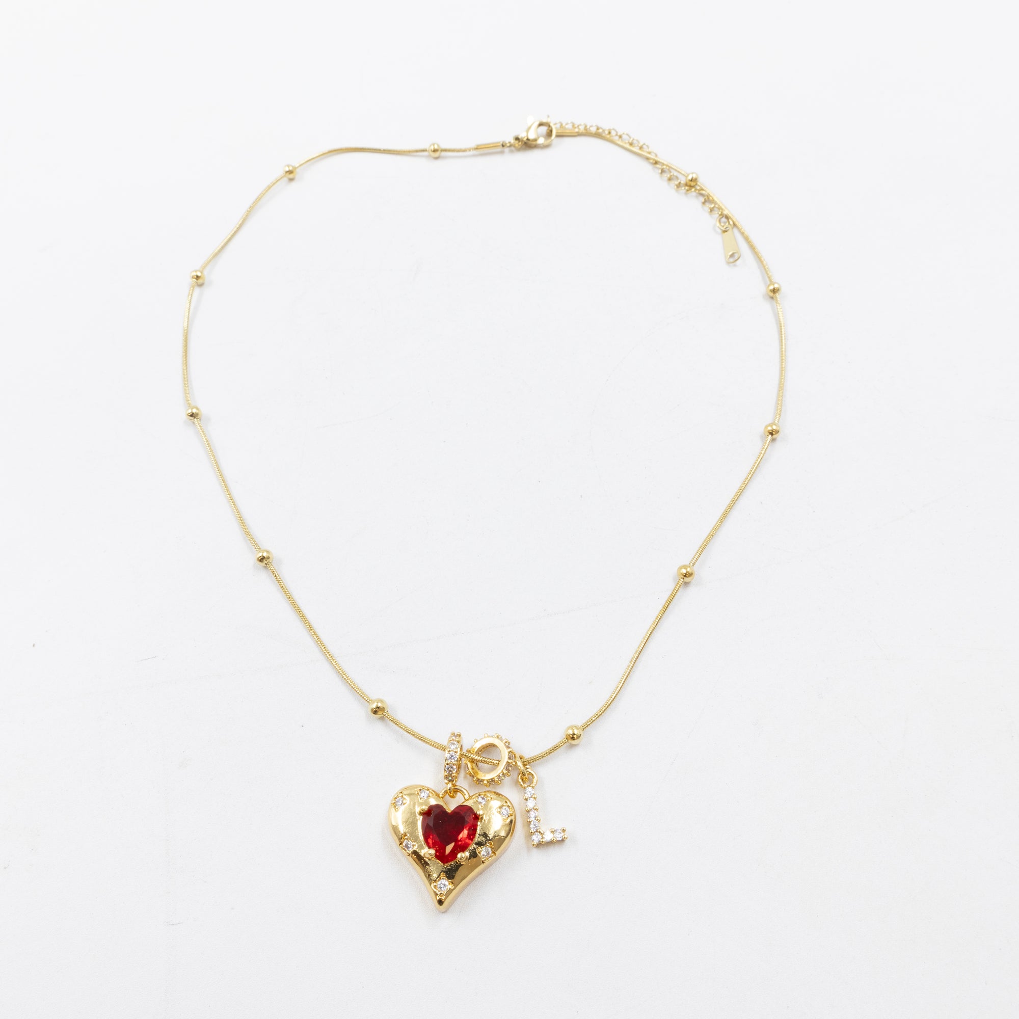 Collares Dorados con dije de Letra y corazón M2 Oro Laminado