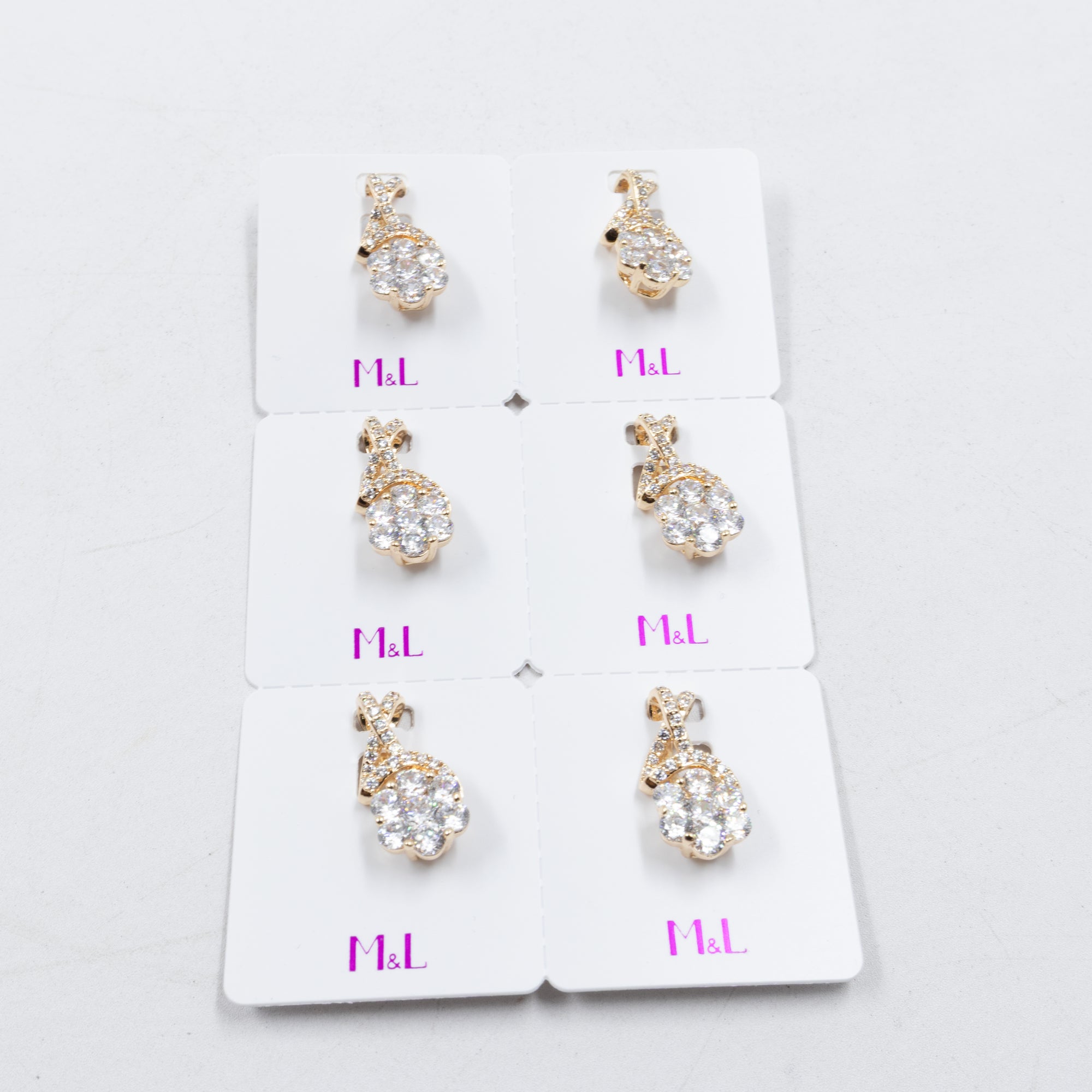Paquete de 6 dijes con Piedras Oro Rosado  M1 Oro Laminado