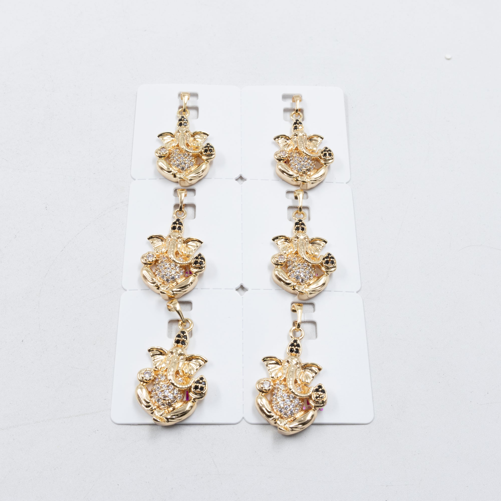 Paquete de 6 dijes con Piedras Oro Rosado  M3 Oro Laminado
