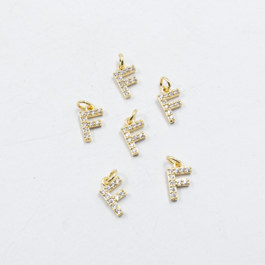 Paquete de 6 Dijes de Letras con piedras M1 Oro Laminado