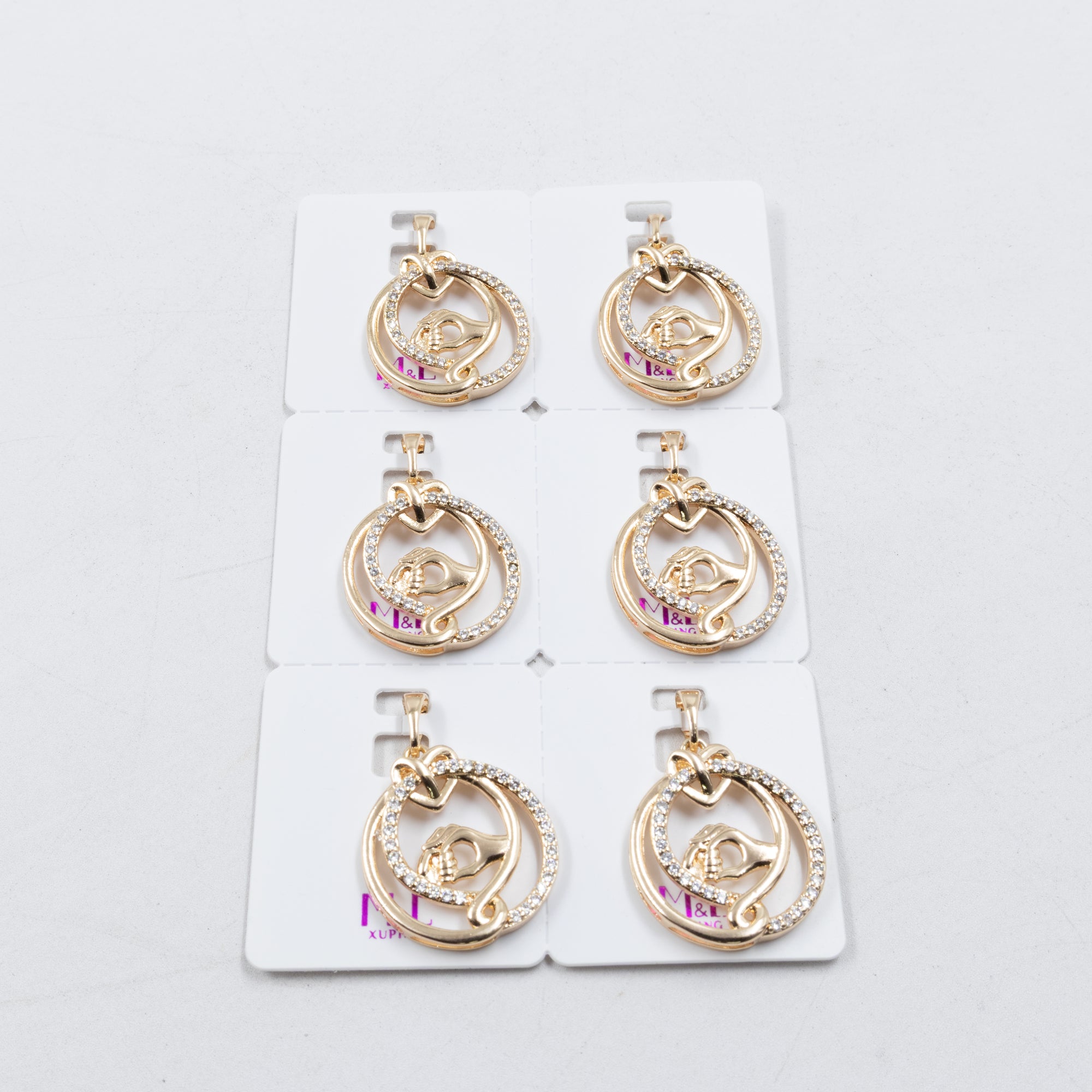 Paquete de 6 dijes con Piedras Oro Rosado  M2 Oro Laminado