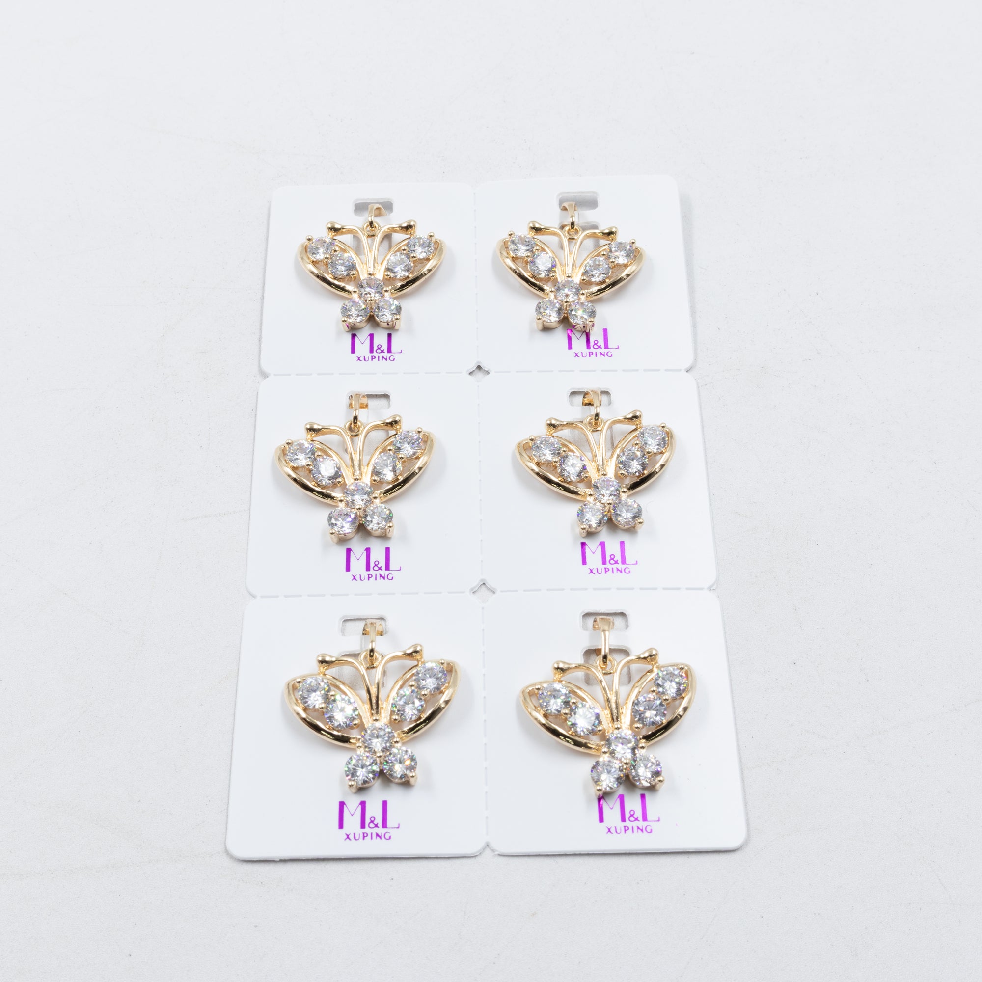 Paquete de 6 dijes con Piedras Oro Rosado  M4 Oro Laminado