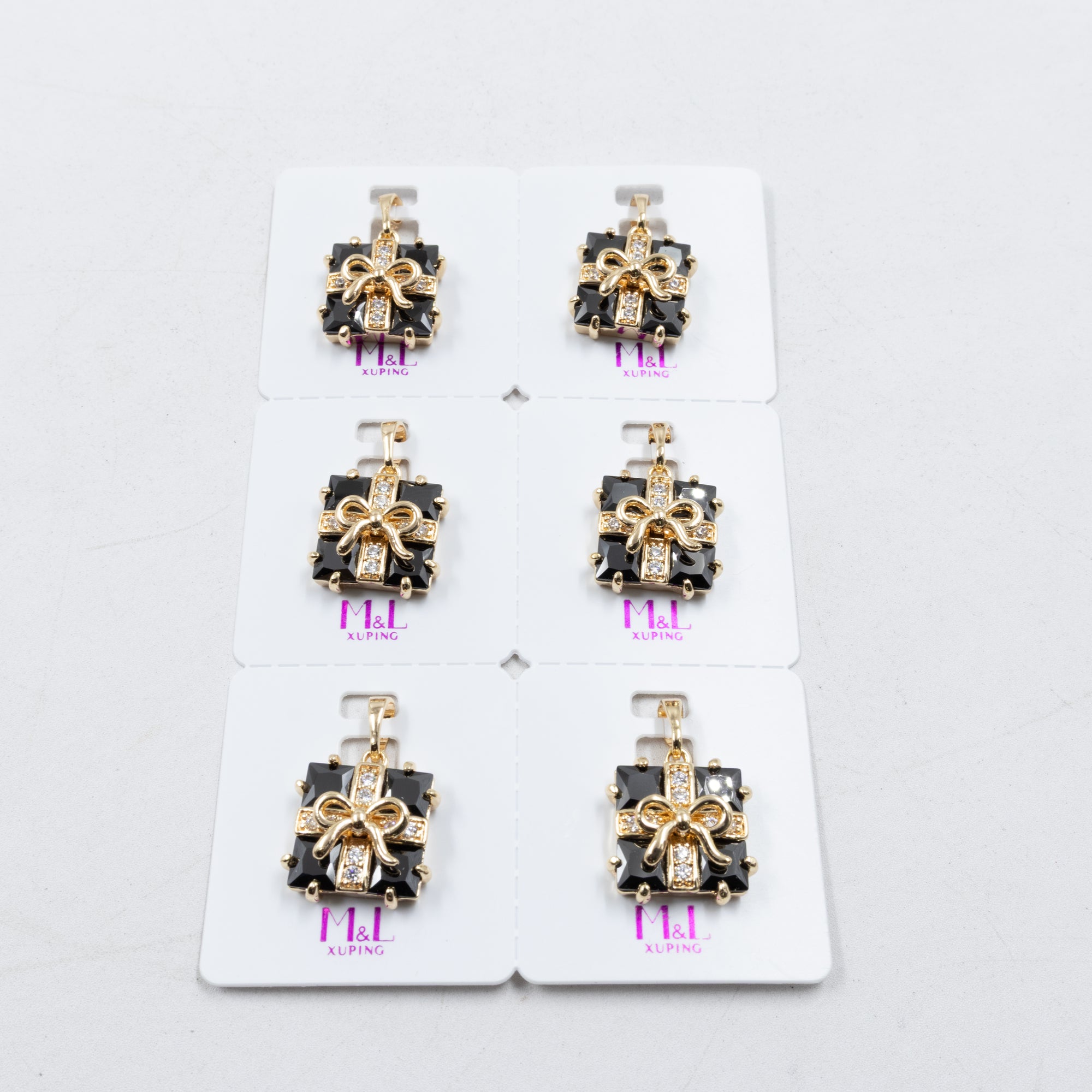 Paquete de 6 dijes con Piedras Oro Rosado  M1 Oro Laminado