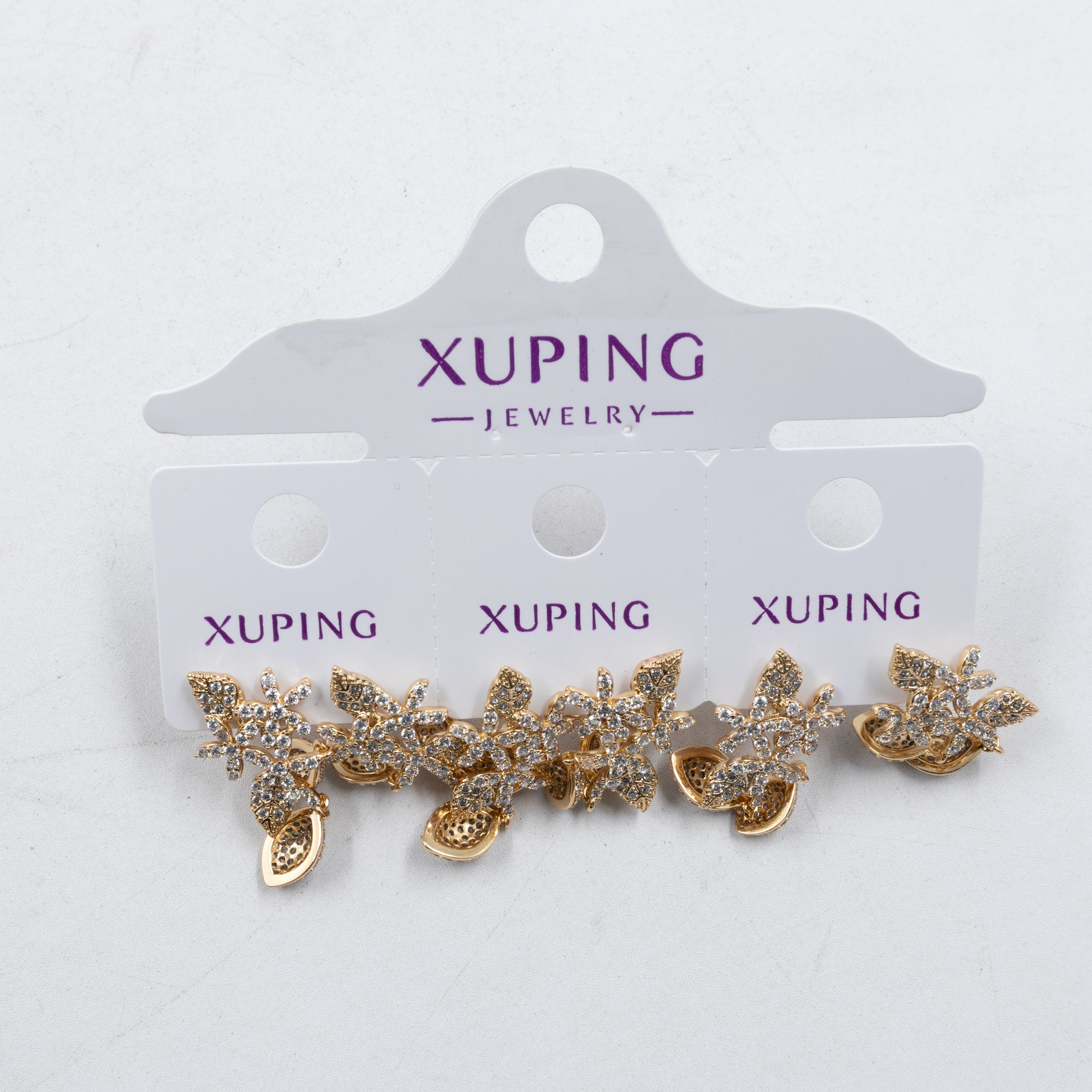 Paquete de tres pares de Aretes Dorados Xuping con piedras M5 Oro Laminado