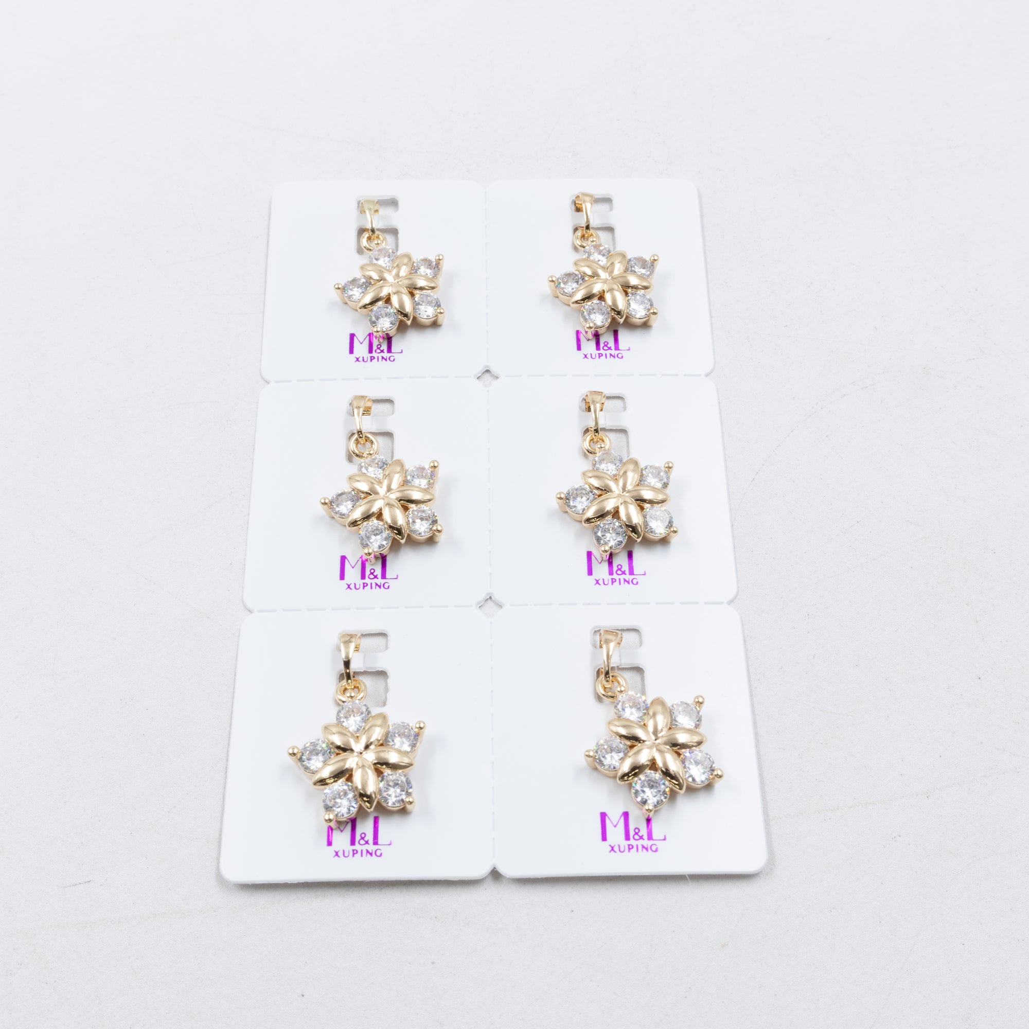 Paquete de 6 dijes con Piedras Oro Rosado  M5 Oro Laminado