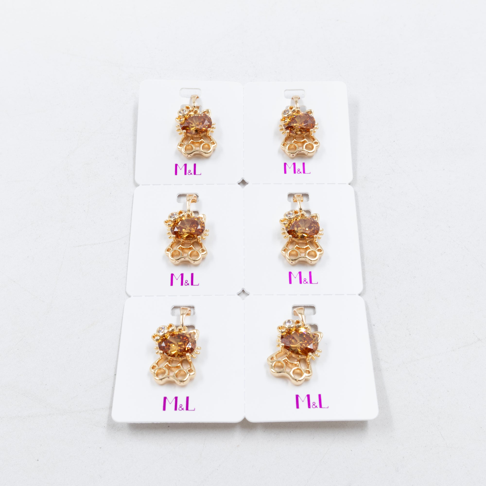 Paquete de 6 dijes con Piedras Oro Rosado  M7 Oro Laminado