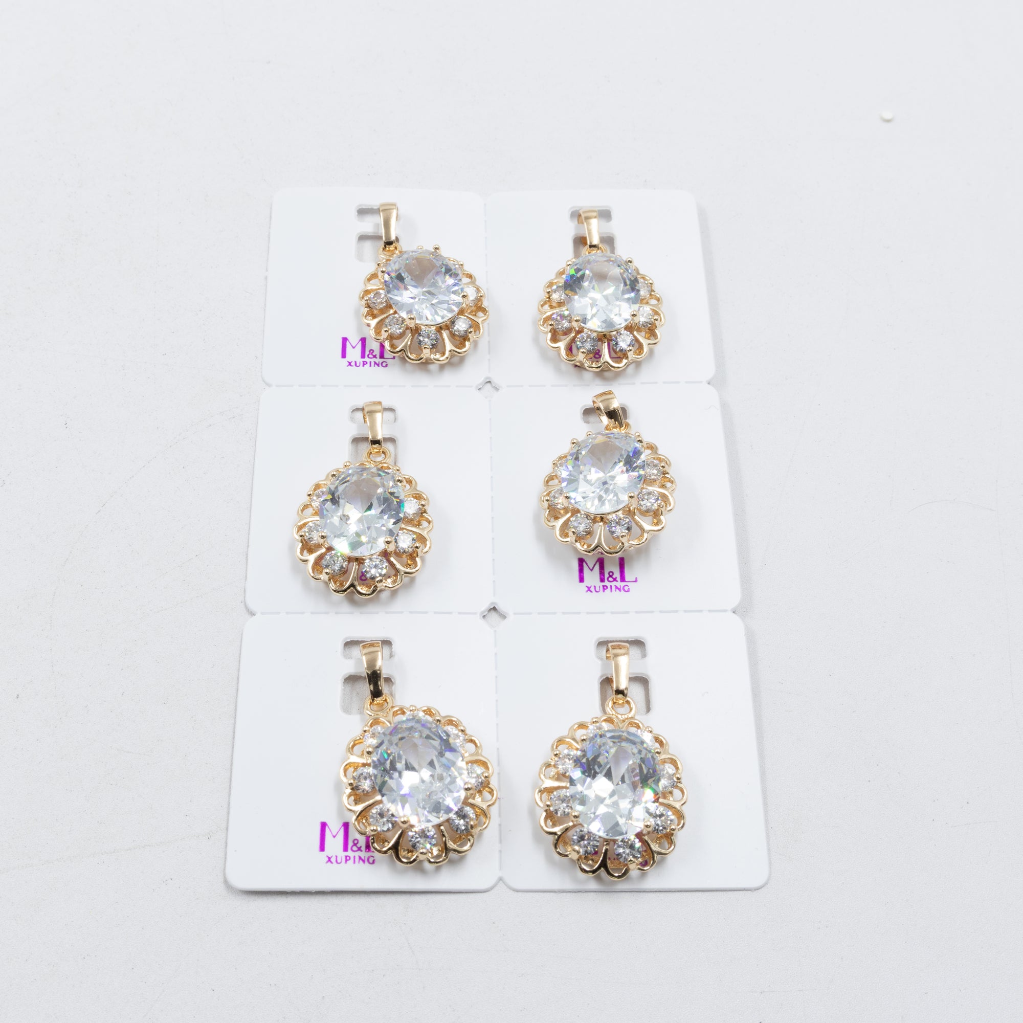 Paquete de 6 dijes con Piedras Oro Rosado  M3 Oro Laminado