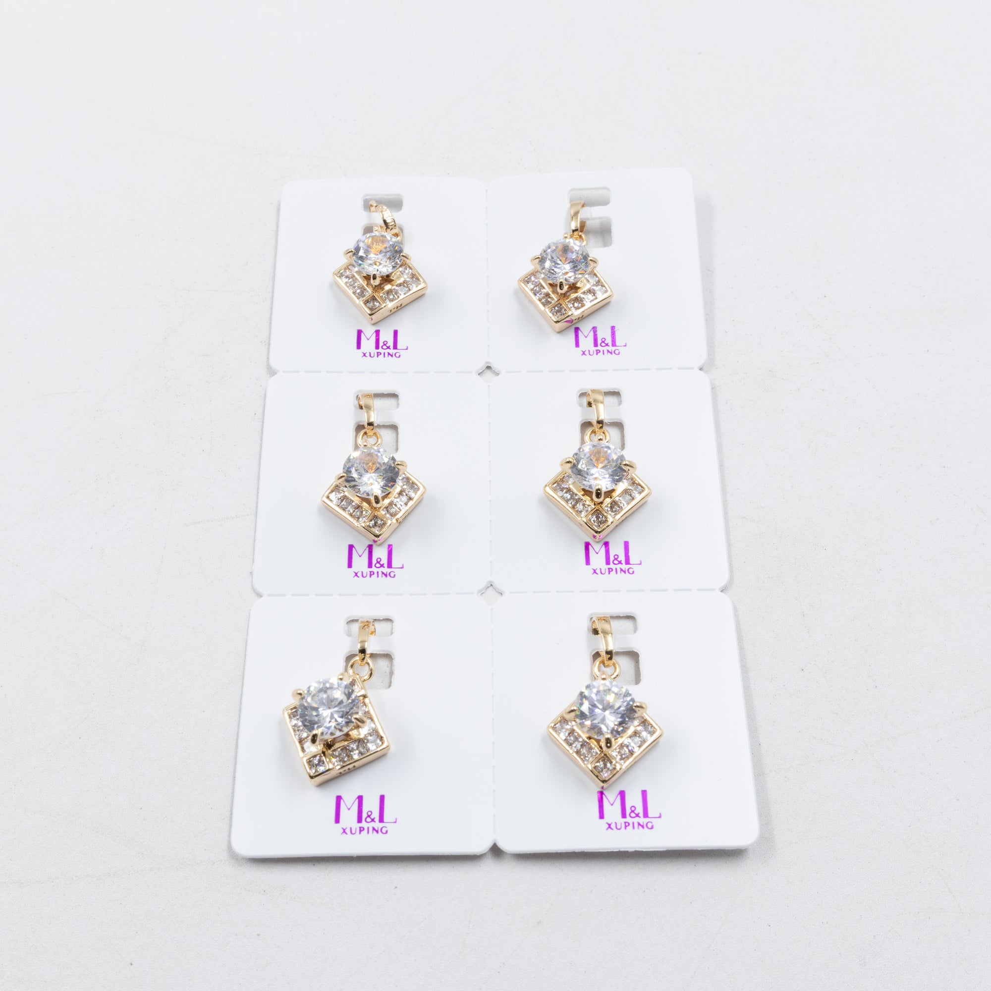 Paquete de 6 dijes con Piedras Oro Rosado  M4 Oro Laminado