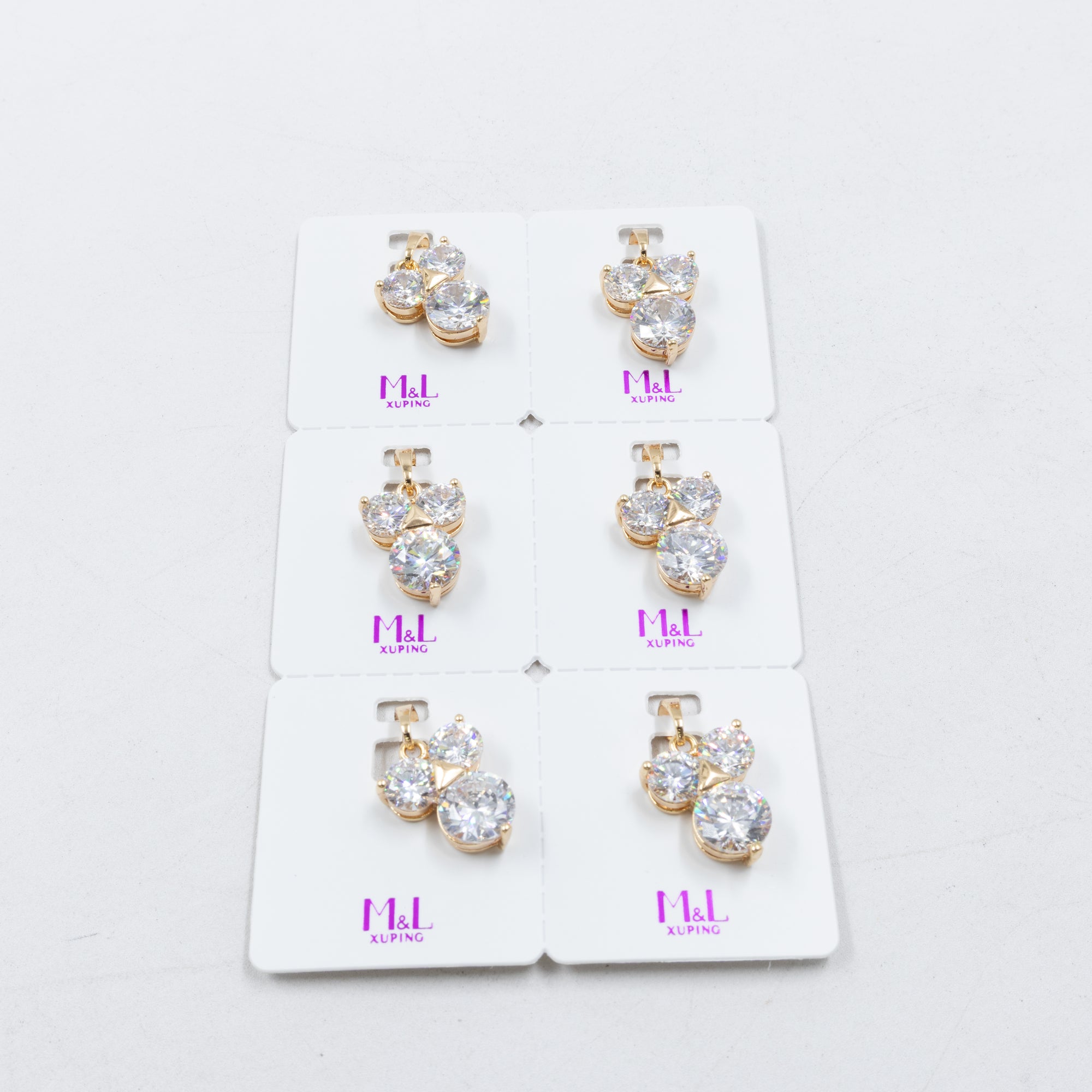Paquete de 6 dijes con Piedras Oro Rosado  M5 Oro Laminado