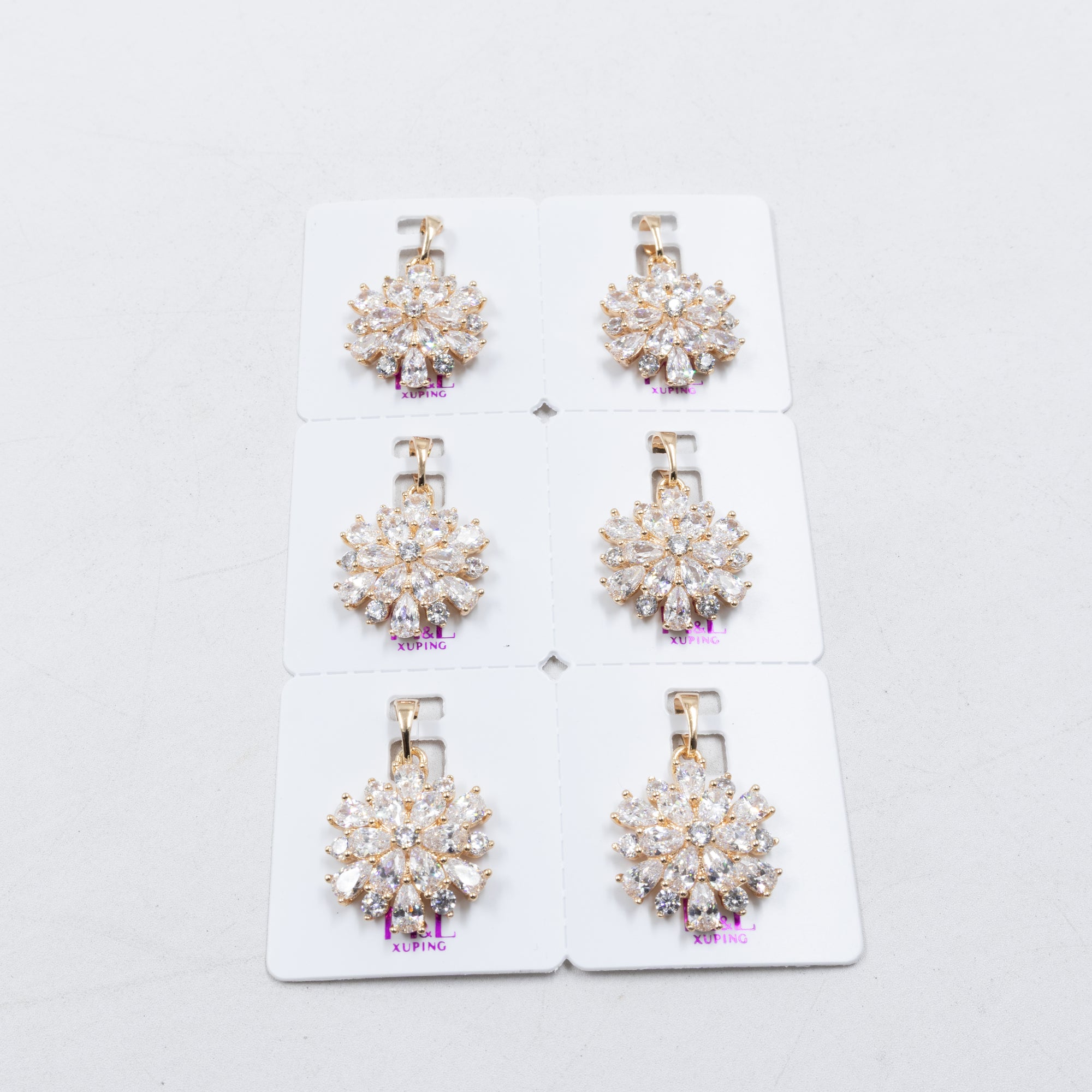 Paquete de 6 dijes con Piedras Oro Rosado  M2 Oro Laminado