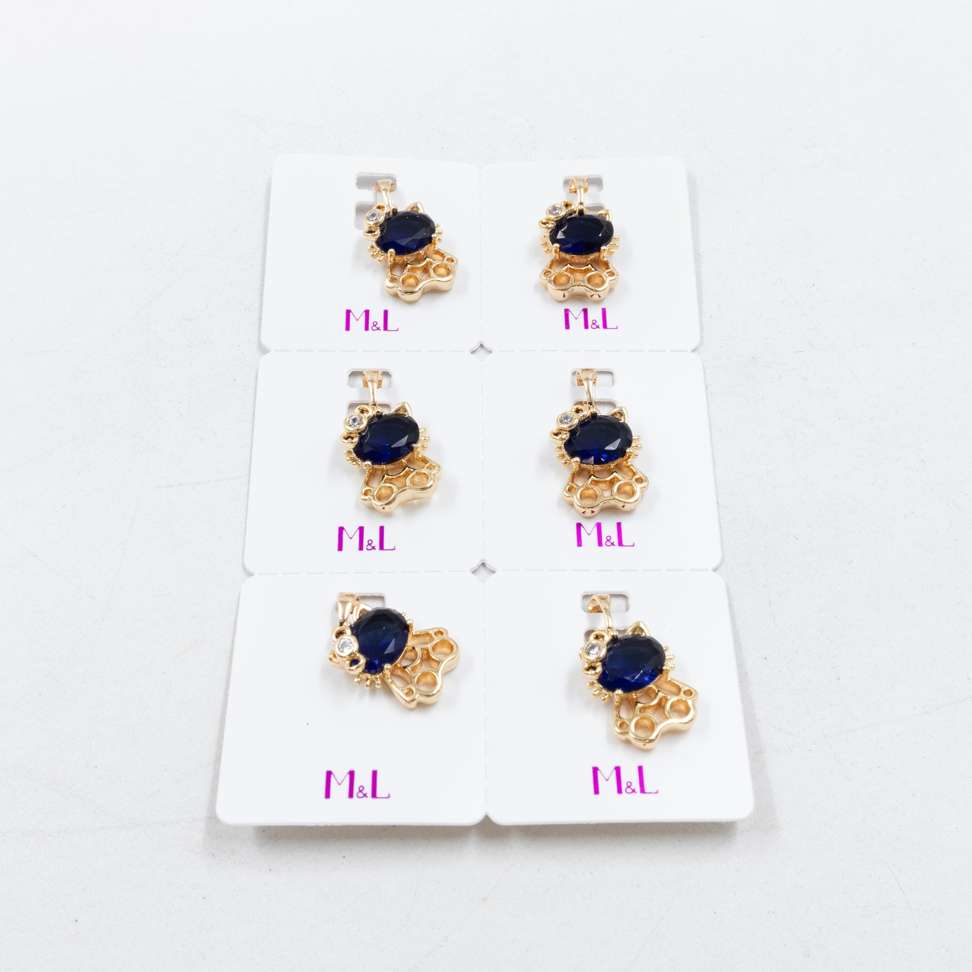 Paquete de 6 dijes con Piedras Oro Rosado  M7 Oro Laminado