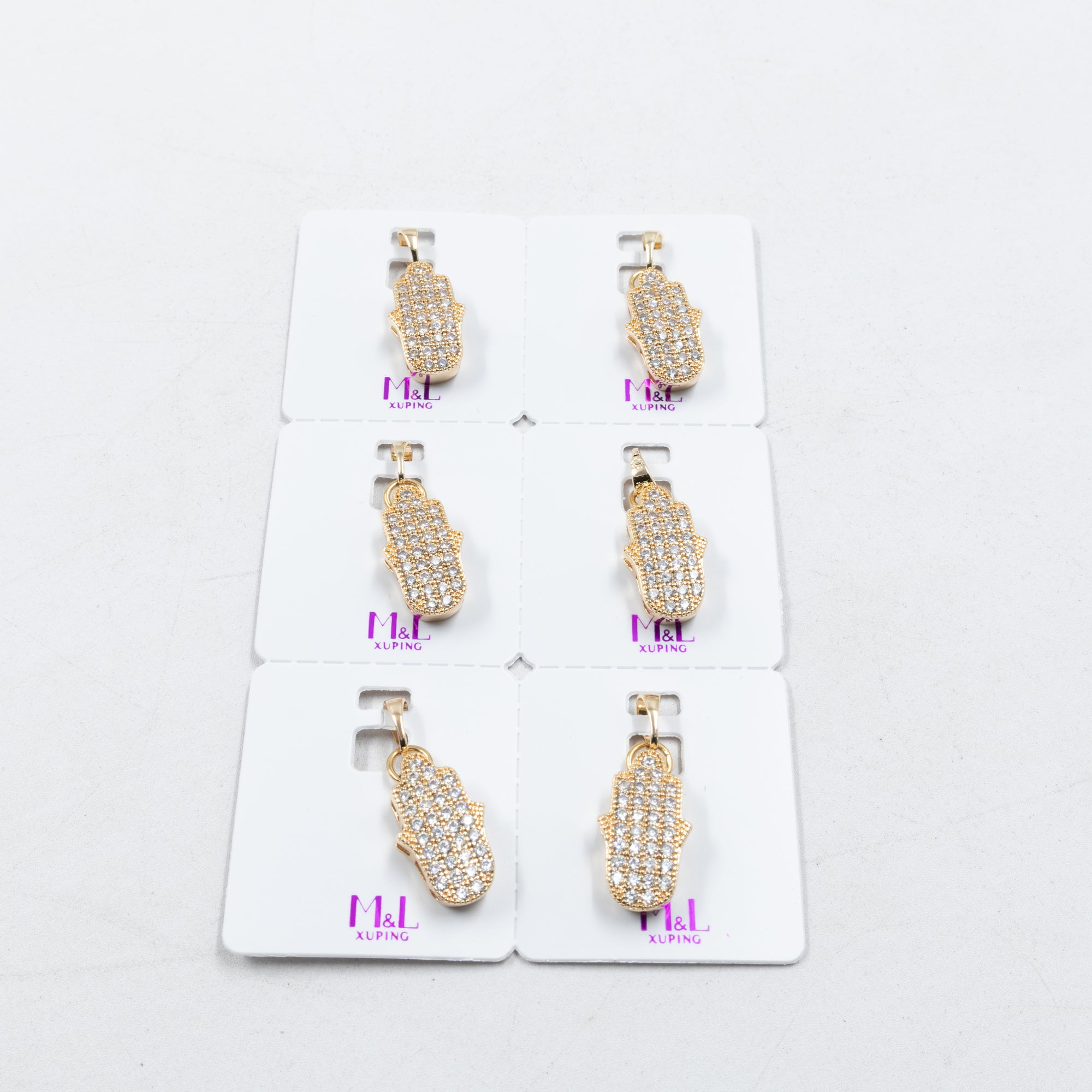 Paquete de 6 dijes con Piedras Oro Rosado  M4 Oro Laminado