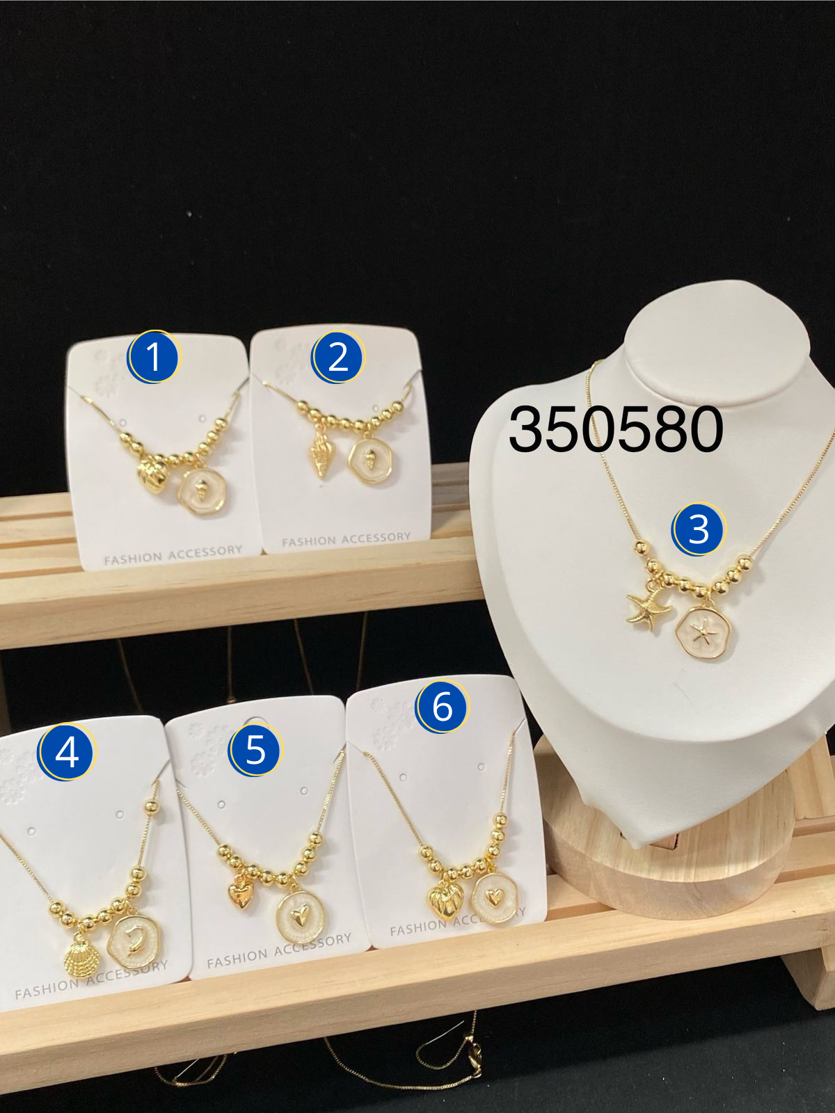 ARETES CON SIMBOLO DEL MAR M1 ORO LAMINADO